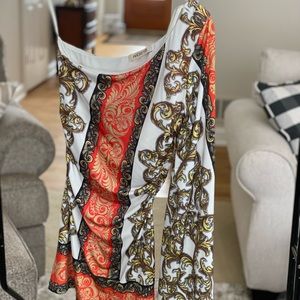 One sleeve shirt. Very cool. NWT. Small